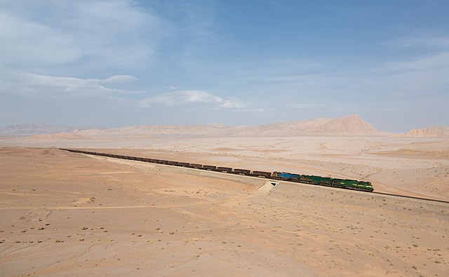 A freight train traversing the Iranian desert