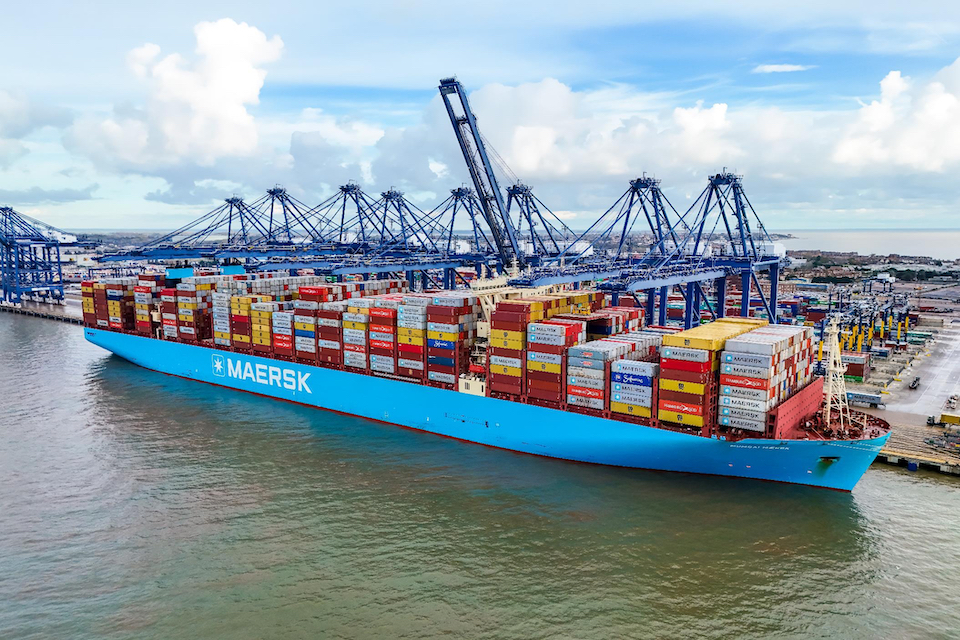 Huge container ship named Mumbai Maersk alongside the docks at Felixstowe, seen from the air