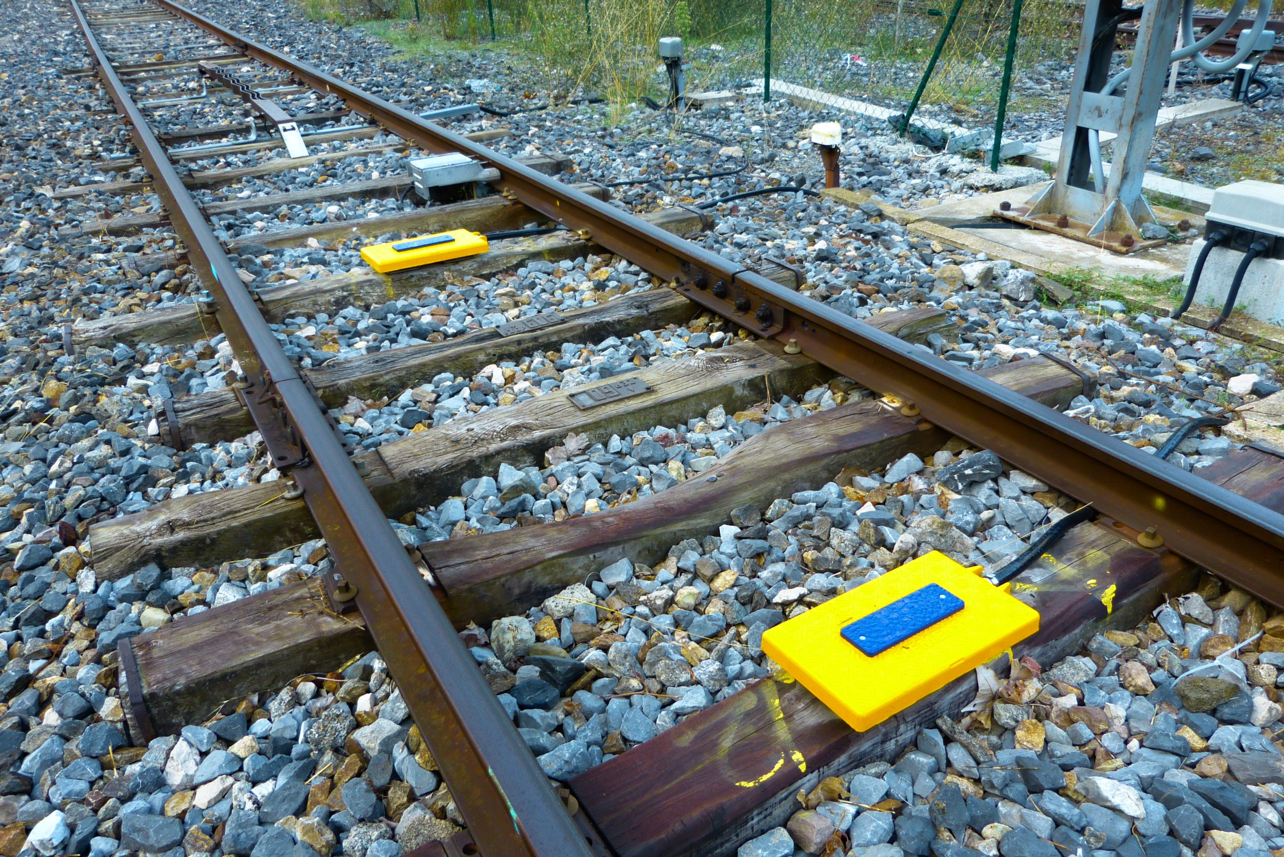 Balises for ETCS-equipped trains, heritage beacon, axle counter, and related equipment on a secondary line in France.